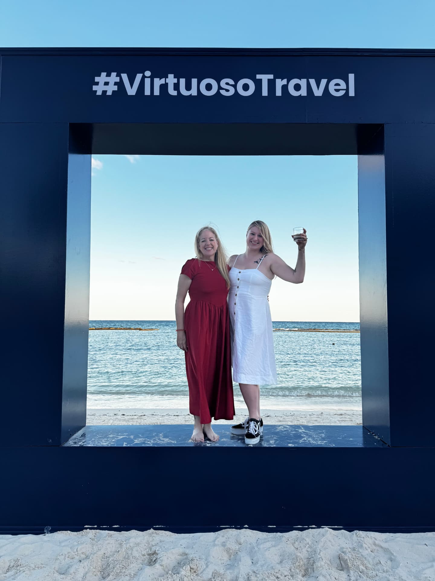 Susan Green and McKenzie McCarty of Susan's Travel Services at a Virtuoso Travel event on the beach